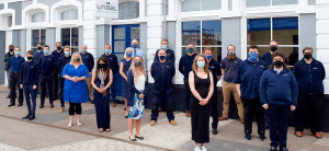 lineal team photo with masks